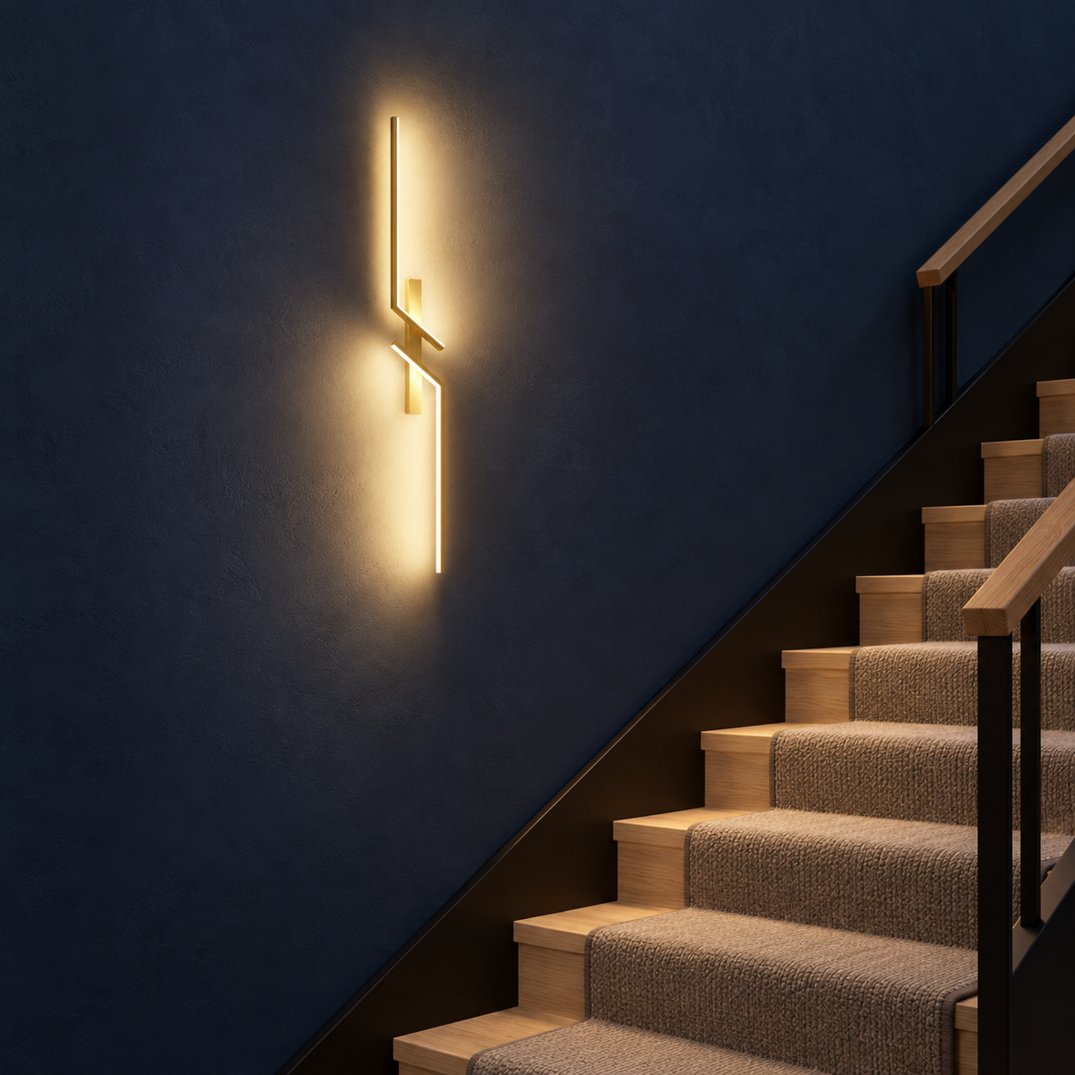 Marel wall light along a navy staircase wall with a light oak handrail